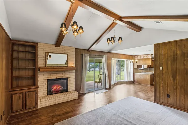 a view of an entryway with wooden floor