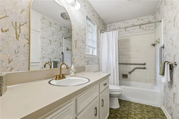 a bathroom with a sink a toilet and a bathtub