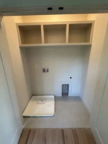 a balcony with wooden floor and fence