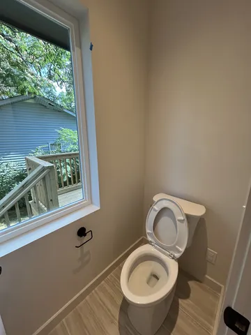 a bathroom with a toilet and a sink