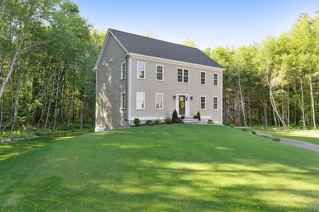 41 Martin Road Douglas, MA 01516 - Photo 2 of 40 a front view of house with yard and green space