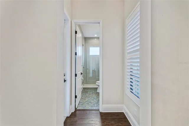 a bathroom with a shower sink and mirror