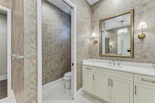 a utility room with sink dryer and washer