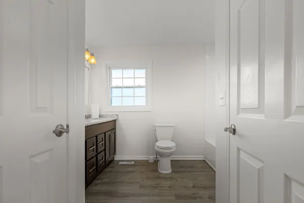 a bathroom with a toilet and a sink
