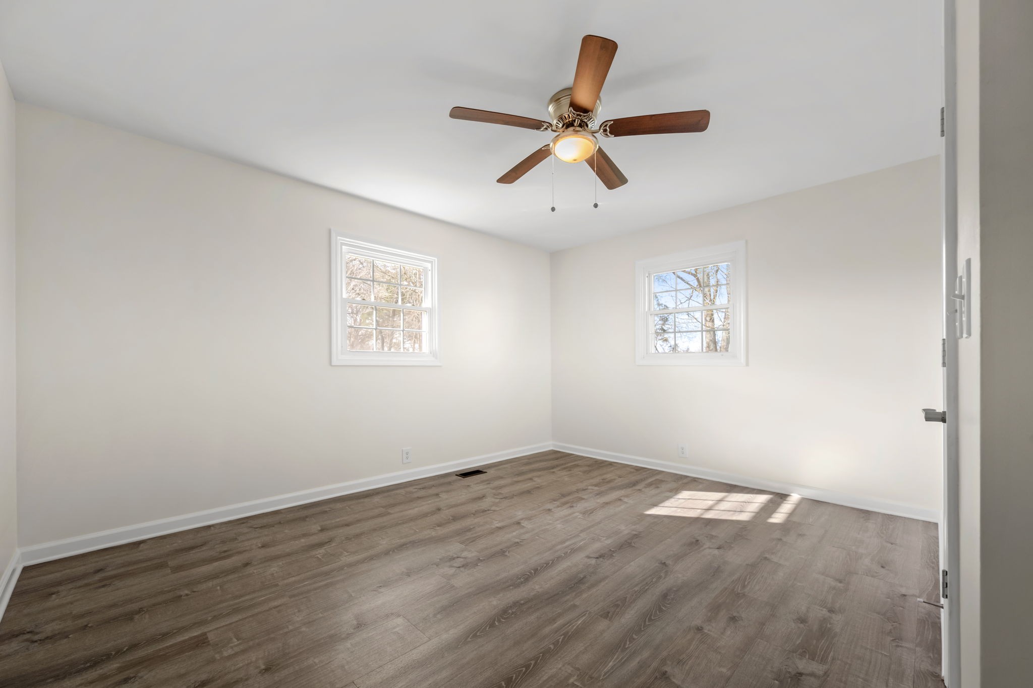 456 Whites Gap Road Huntland, TN 37345 - Photo 21 of 35 a view of a big room with wooden floor and windows