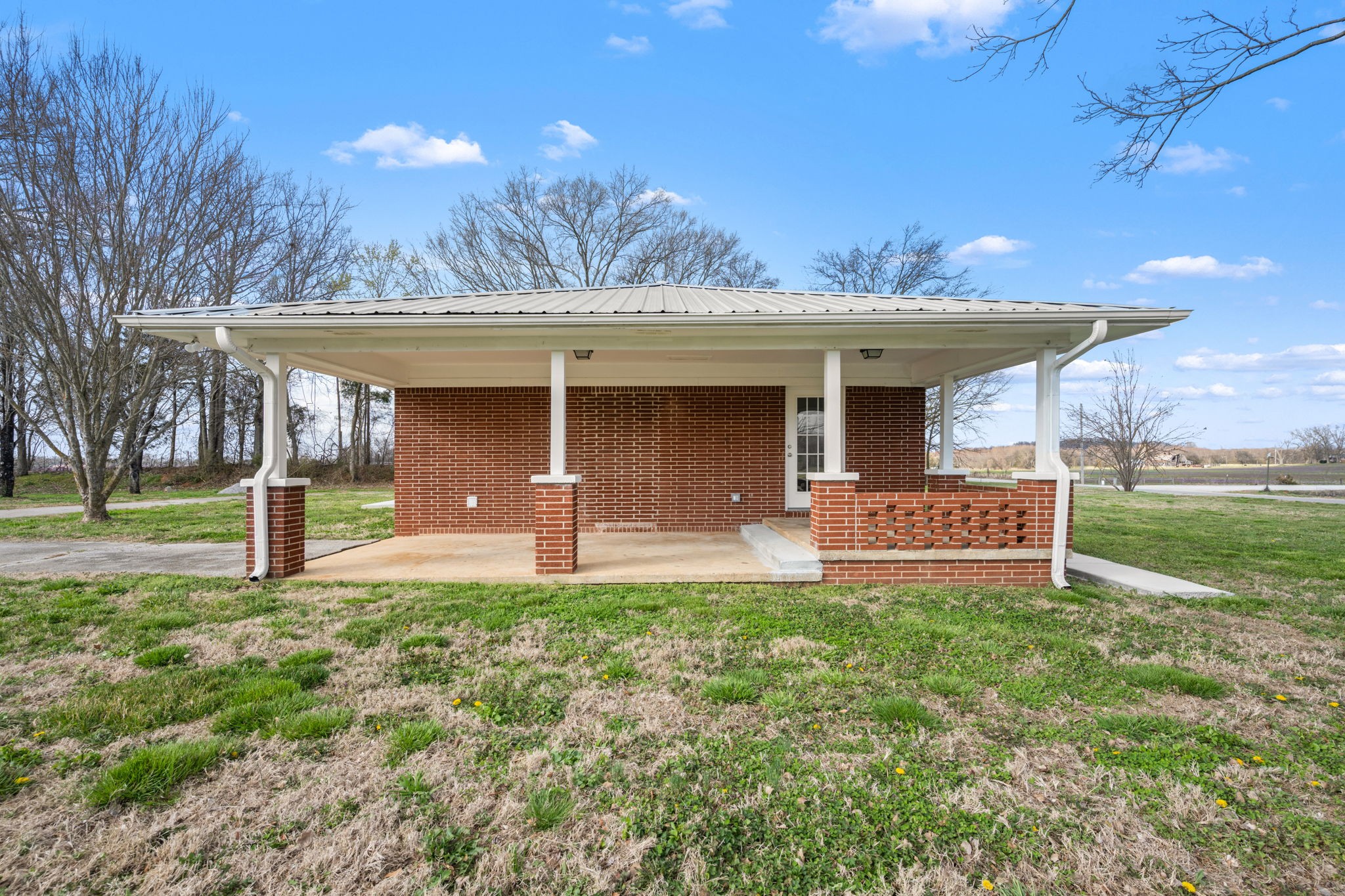 456 Whites Gap Road Huntland, TN 37345 - Photo 23 of 35 a front view of a house with a yard and garage