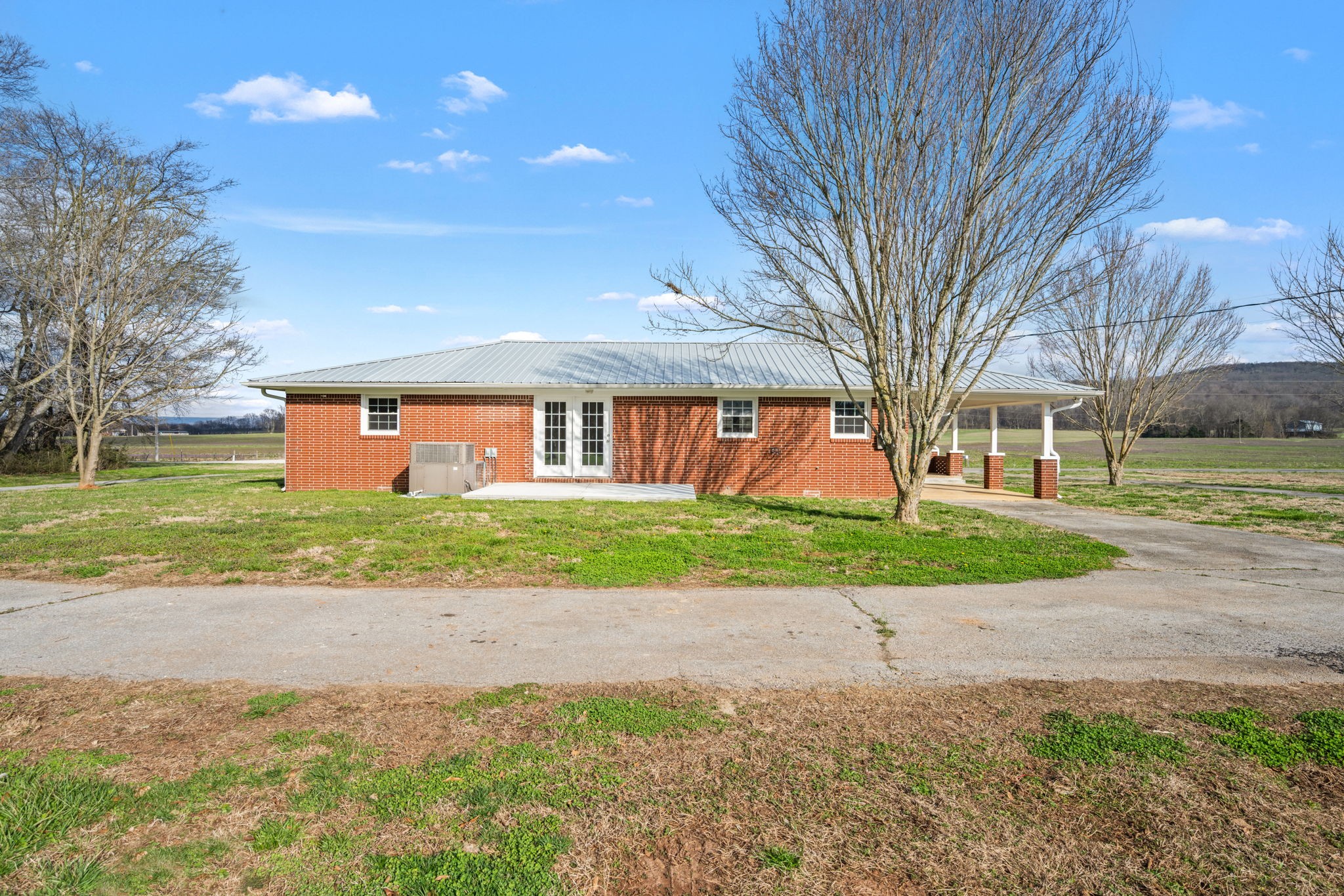 456 Whites Gap Road Huntland, TN 37345 - Photo 29 of 35 a front view of a house with a yard and a garage