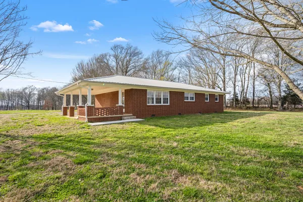 a view of a house with a big yard