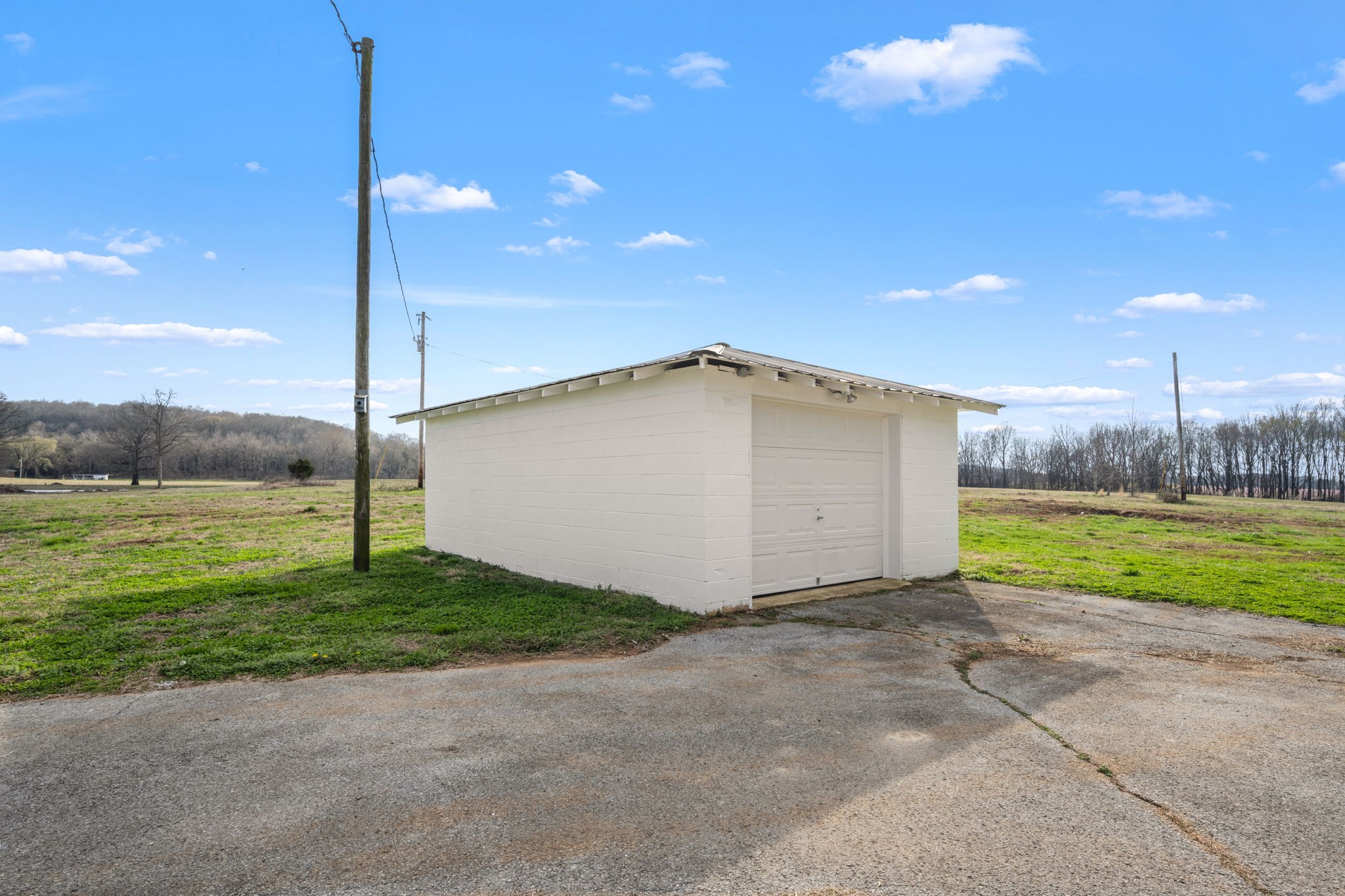 456 Whites Gap Road Huntland, TN 37345 - Photo 35 of 35 a view of a house with a yard and a basket ball court