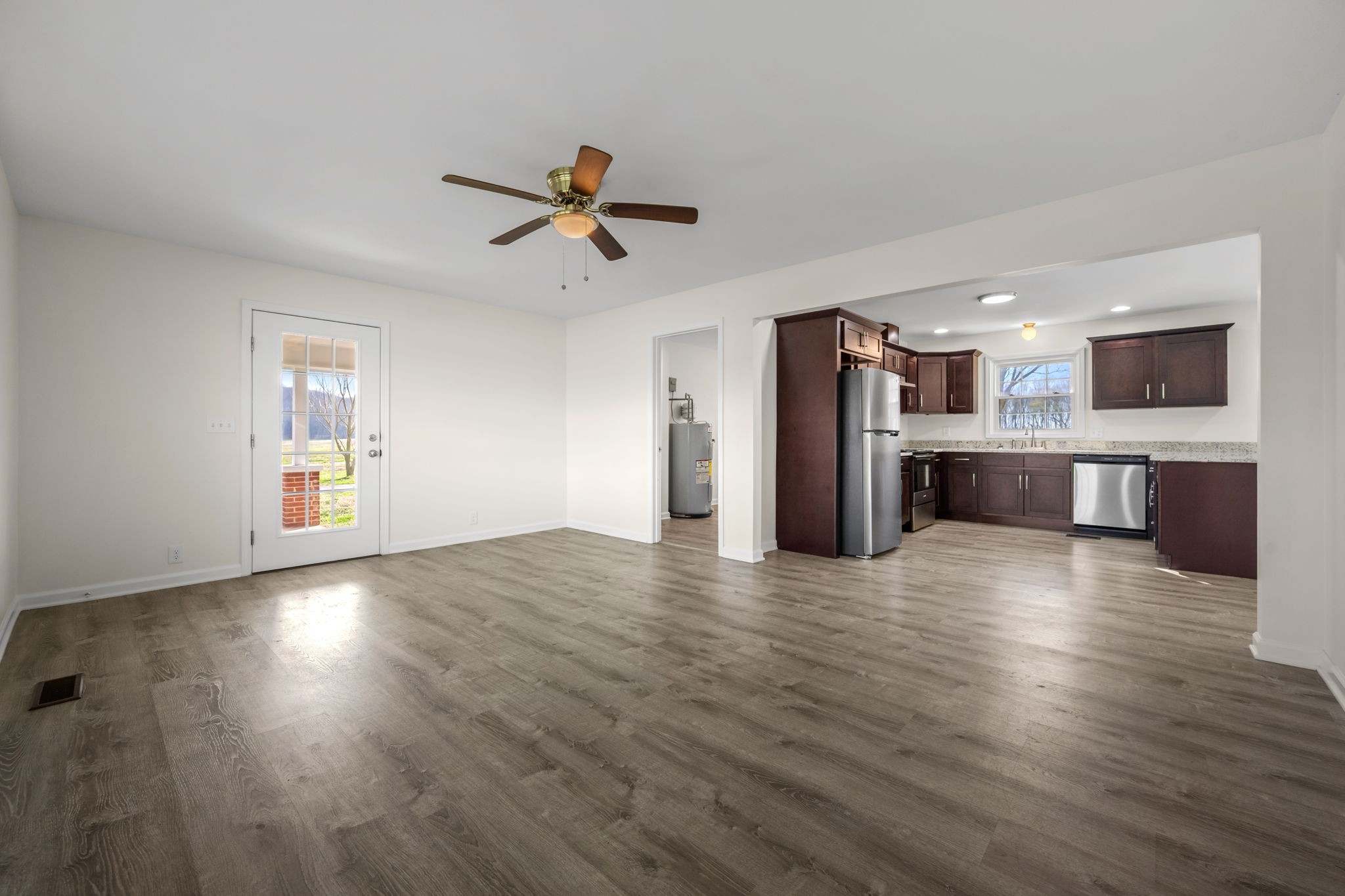 456 Whites Gap Road Huntland, TN 37345 - Photo 6 of 35 a view of a kitchen with a sink and a refrigerator