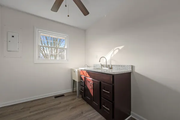 a utility room with a sink dryer and washer
