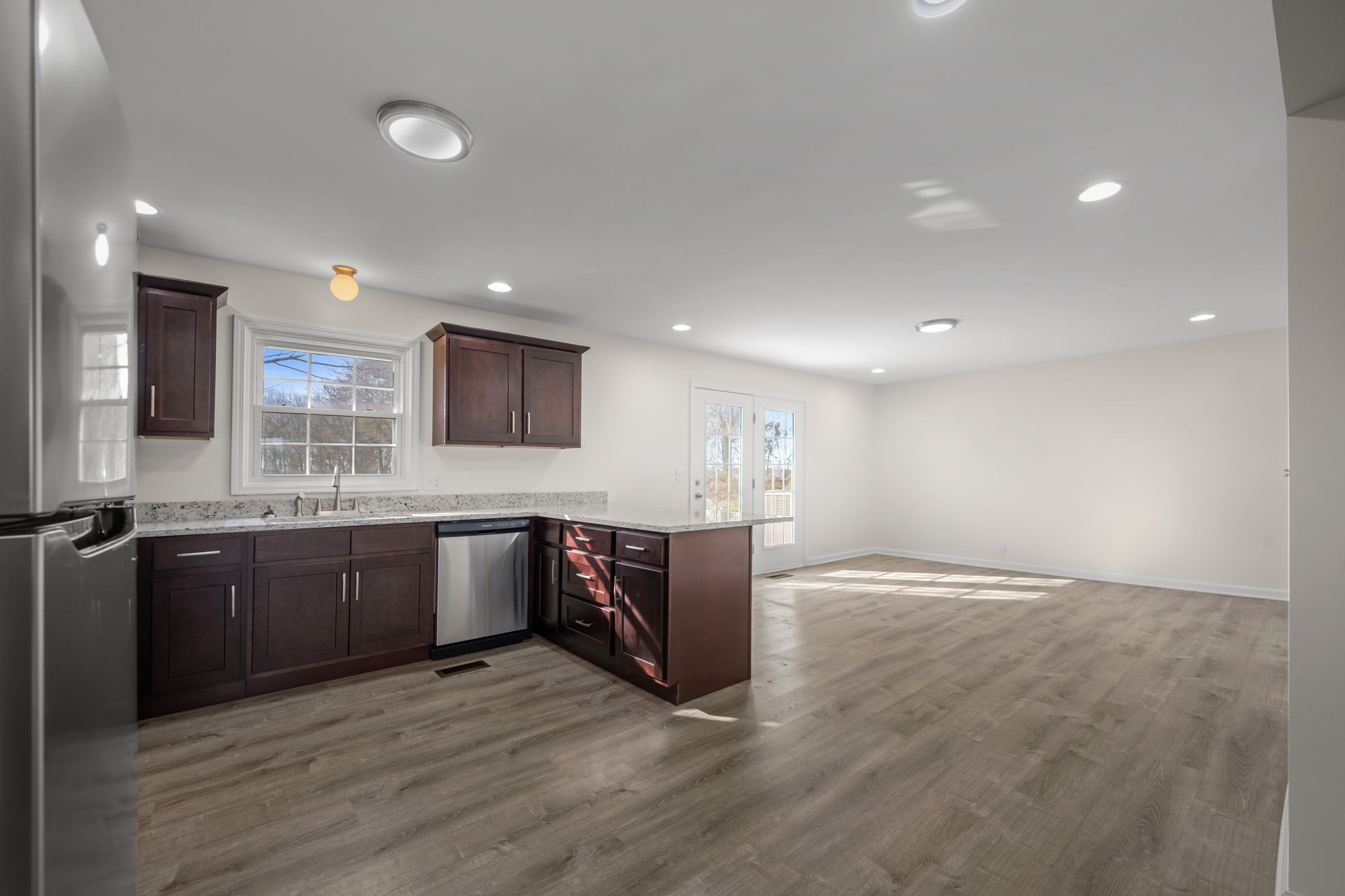 456 Whites Gap Road Huntland, TN 37345 - Photo 10 of 35 a large kitchen with stainless steel appliances granite countertop a large stove a sink and a refrigerator
