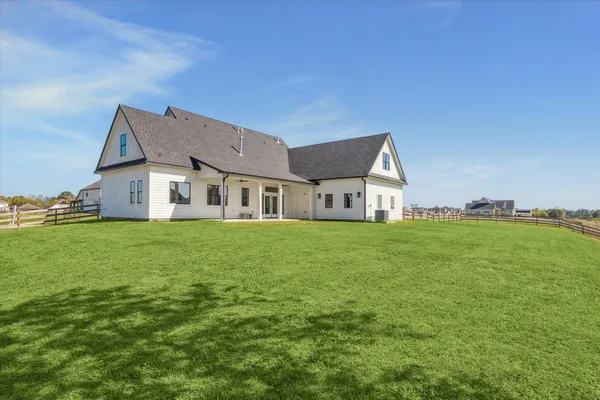 a view of a house with a big yard