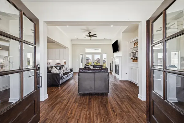 a living room with furniture and a large window