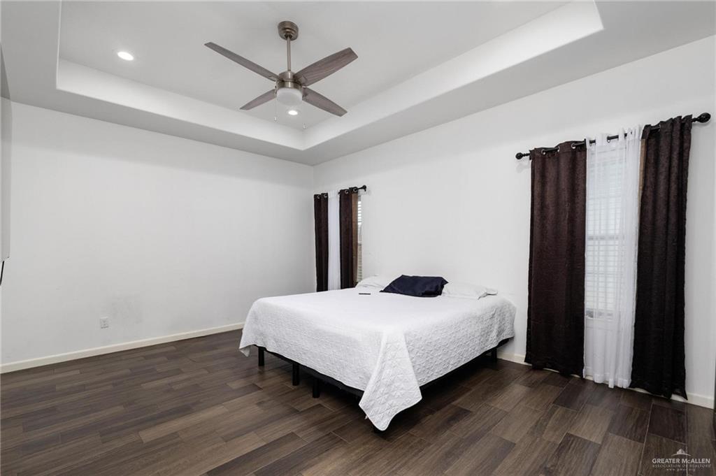 405 Scarlett Red Harlingen, TX 78552 - Photo 12 of 15 a bedroom with a bed and a large window