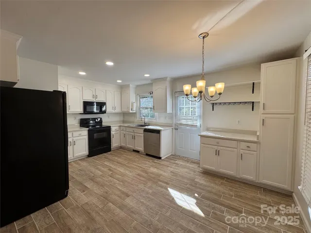 a kitchen with a refrigerator a sink and dishwasher