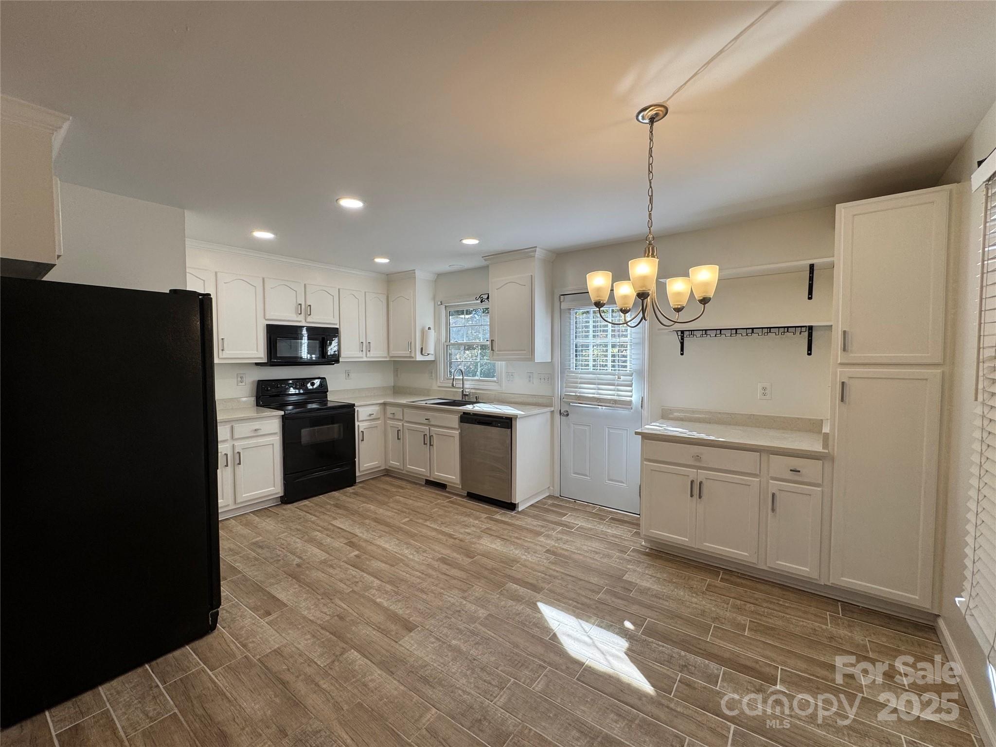 314 East Louisiana Avenue Bessemer City, NC 28016 - Photo 2 of 15 a kitchen with a refrigerator a sink and dishwasher