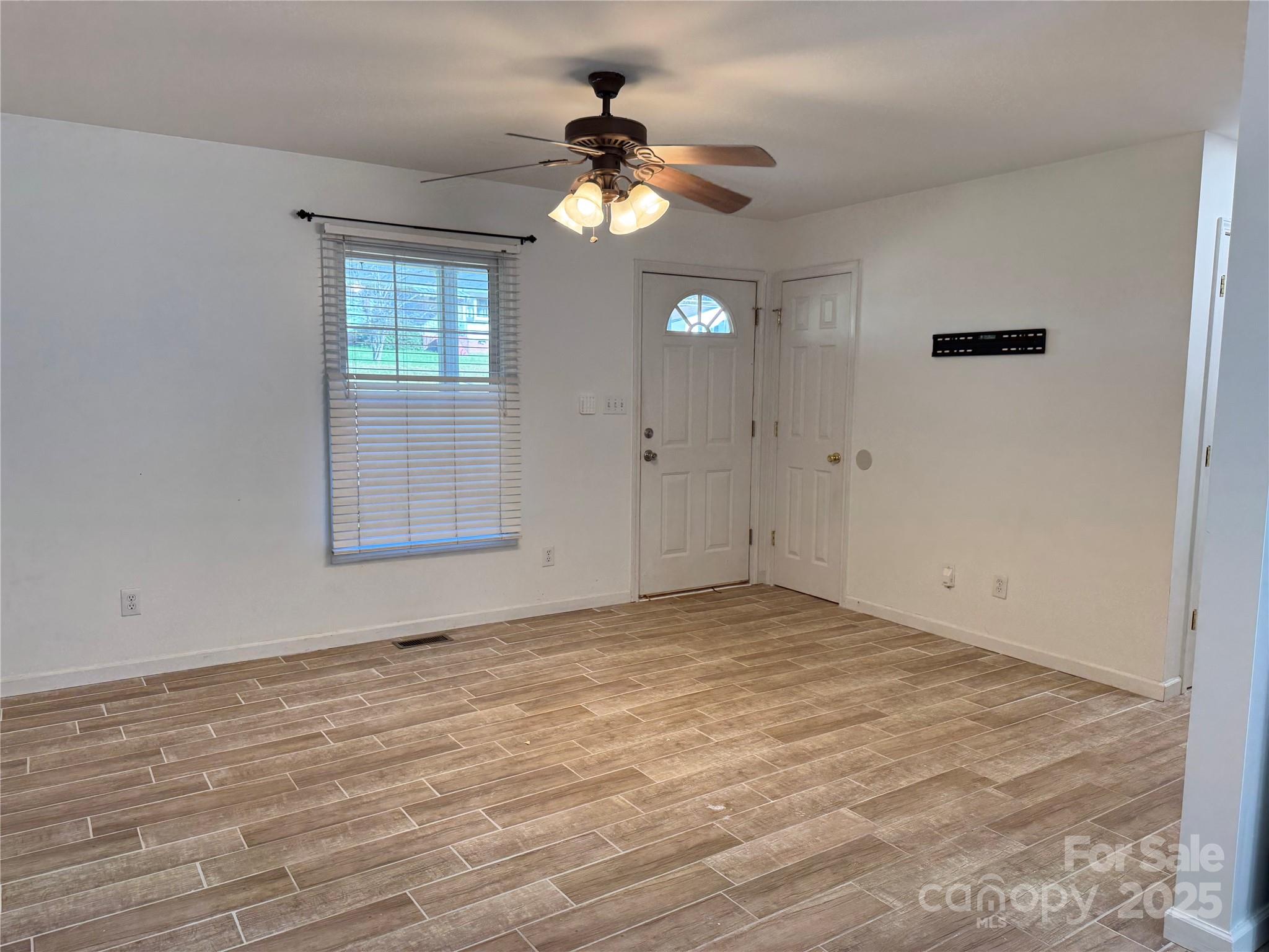 314 East Louisiana Avenue Bessemer City, NC 28016 - Photo 5 of 15 a view of an empty room with a window