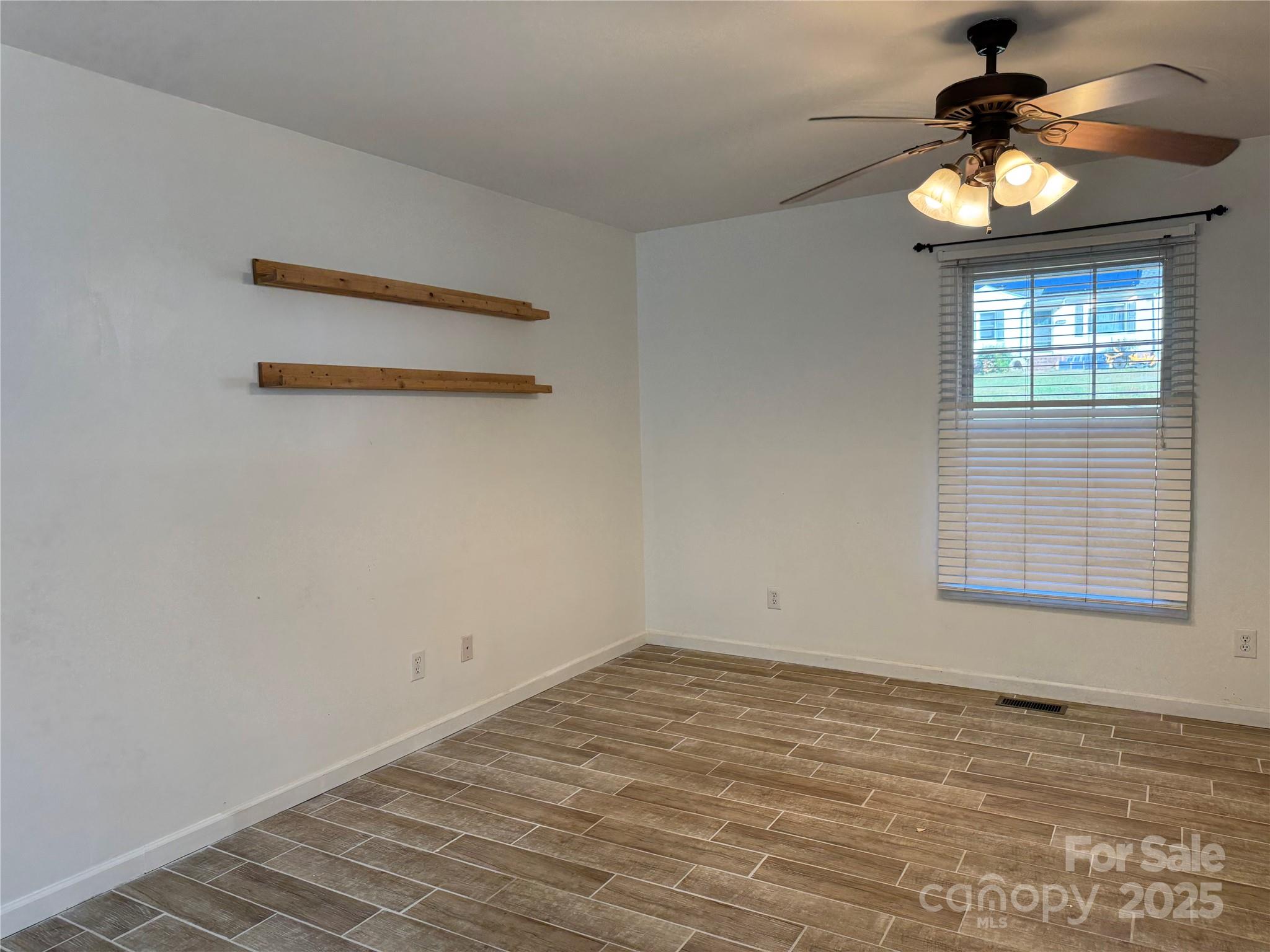 314 East Louisiana Avenue Bessemer City, NC 28016 - Photo 6 of 15 en empty room with window