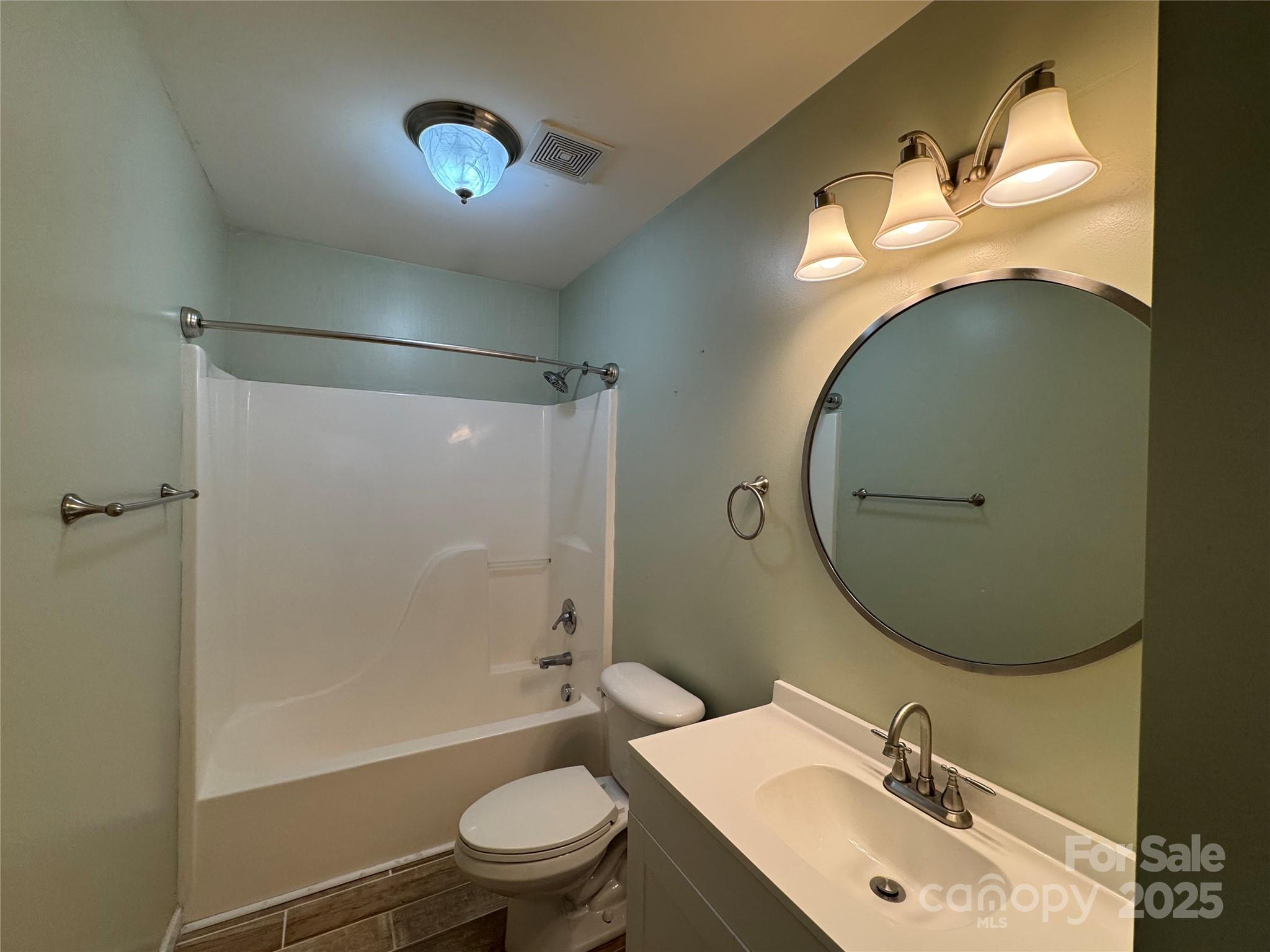 314 East Louisiana Avenue Bessemer City, NC 28016 - Photo 7 of 15 a bathroom with a sink mirror toilet and shower