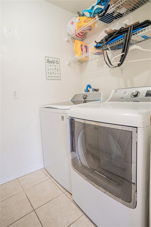 1836 Ridge Valley Street Clermont, FL 34711 - Photo 19 of 45 a utility room with dryer and washer
