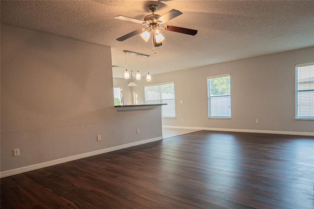 1836 Ridge Valley Street Clermont, FL 34711 - Photo 25 of 45 a view of an empty room with wooden floor and a window