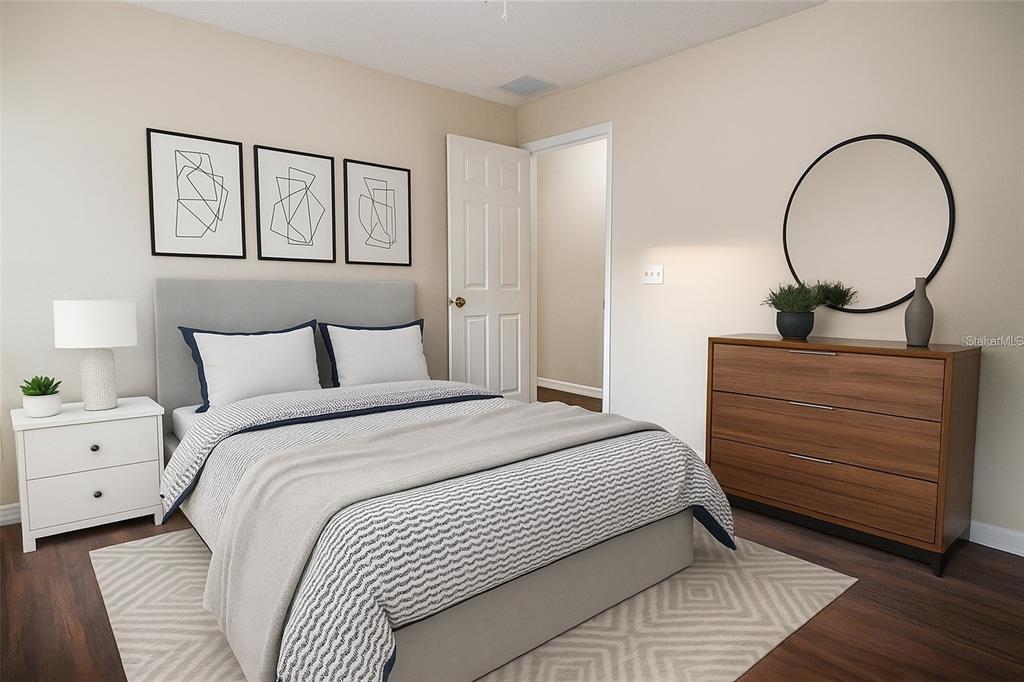 1836 Ridge Valley Street Clermont, FL 34711 - Photo 26 of 45 a bedroom with a bed and a painting on the wall