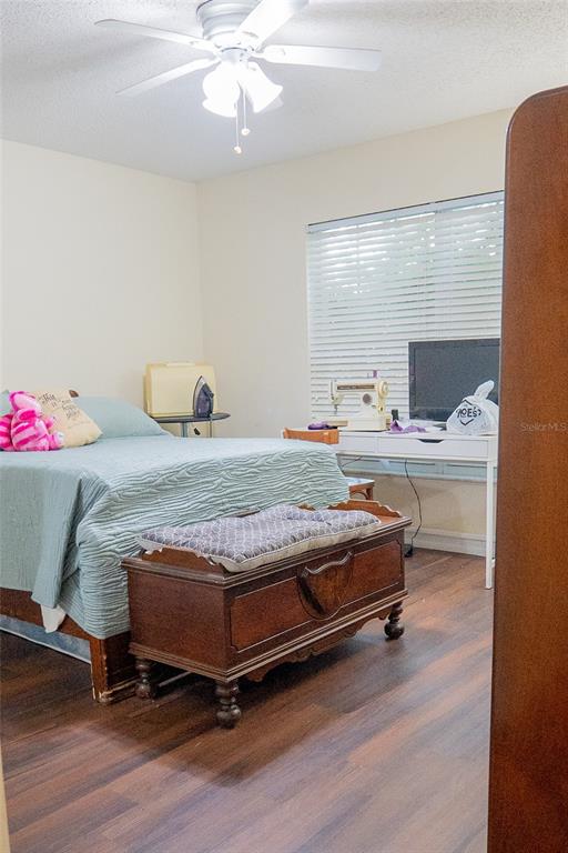 1836 Ridge Valley Street Clermont, FL 34711 - Photo 27 of 45 a bedroom with a bed and wooden floor