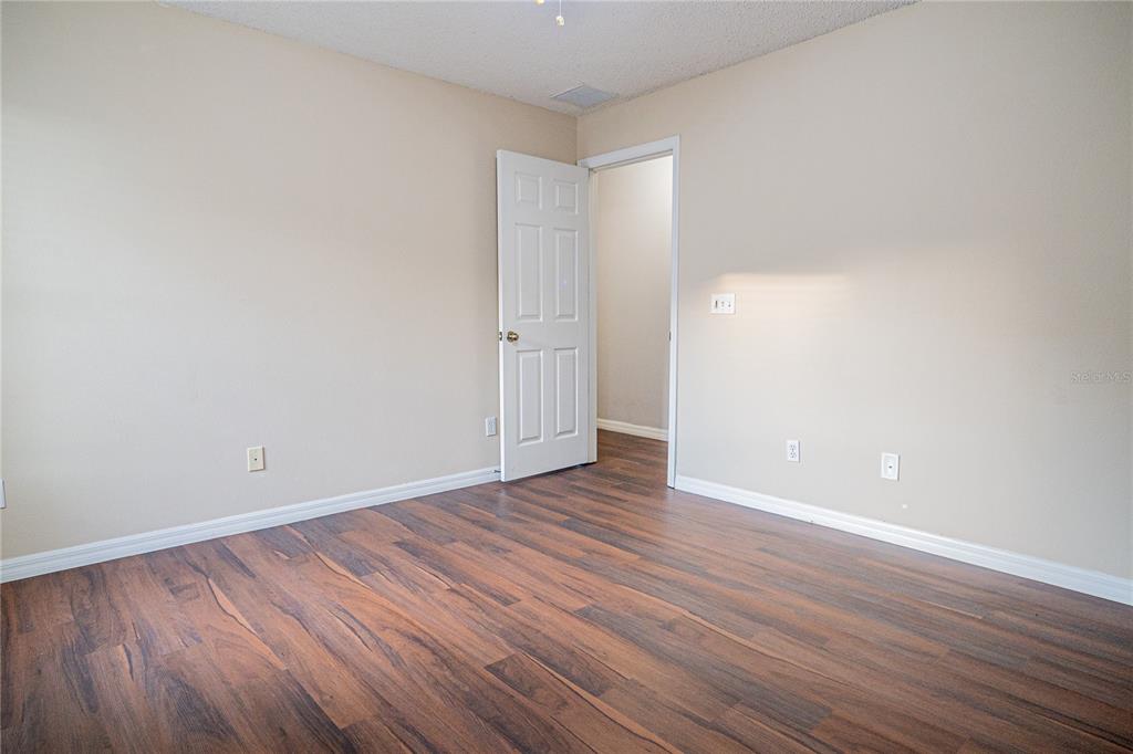 1836 Ridge Valley Street Clermont, FL 34711 - Photo 33 of 45 a view of an empty room with wooden floor and closet