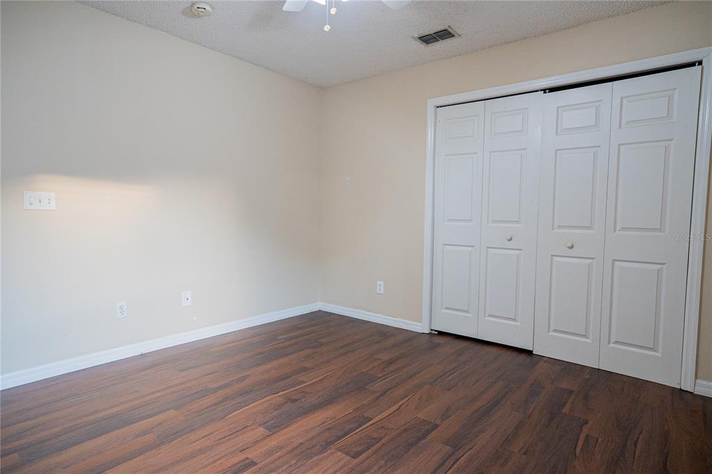 1836 Ridge Valley Street Clermont, FL 34711 - Photo 34 of 45 a view of an empty room with wooden floor
