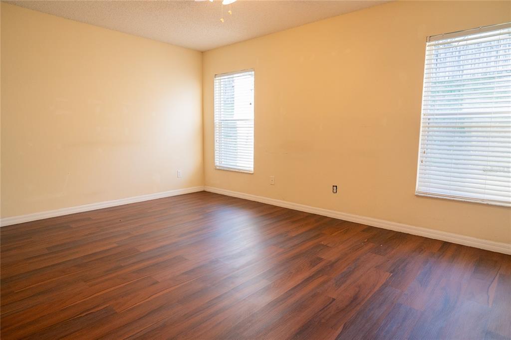 1836 Ridge Valley Street Clermont, FL 34711 - Photo 38 of 45 an empty room with wooden floor and windows