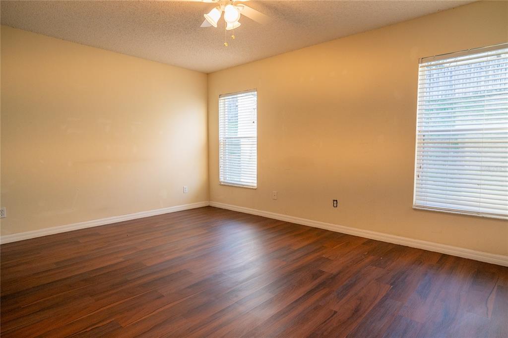 1836 Ridge Valley Street Clermont, FL 34711 - Photo 39 of 45 a view of an empty room with wooden floor and a window