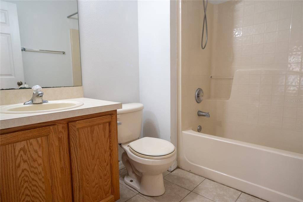 1836 Ridge Valley Street Clermont, FL 34711 - Photo 44 of 45 a bathroom with a sink a toilet and shower