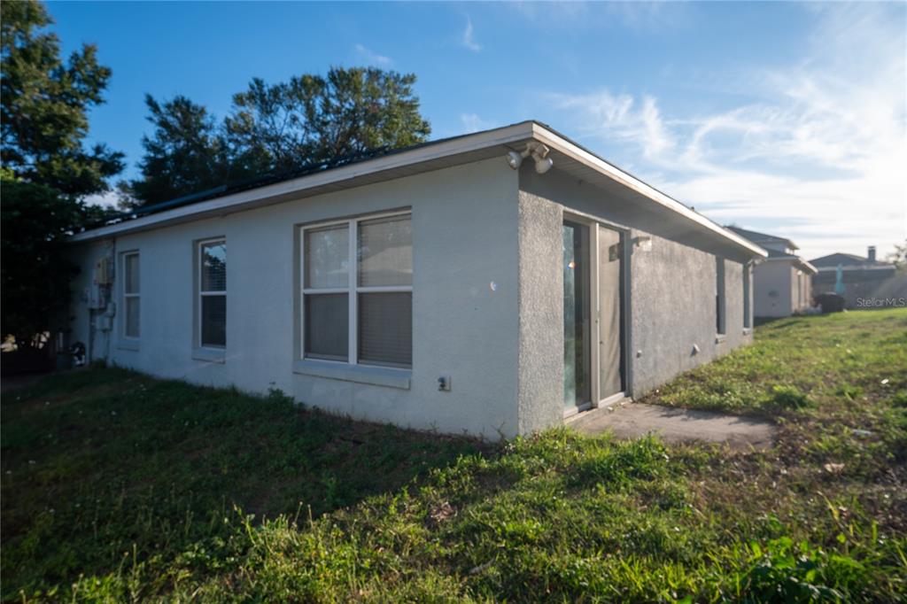 1836 Ridge Valley Street Clermont, FL 34711 - Photo 10 of 45 a backyard of a house with lots of green space