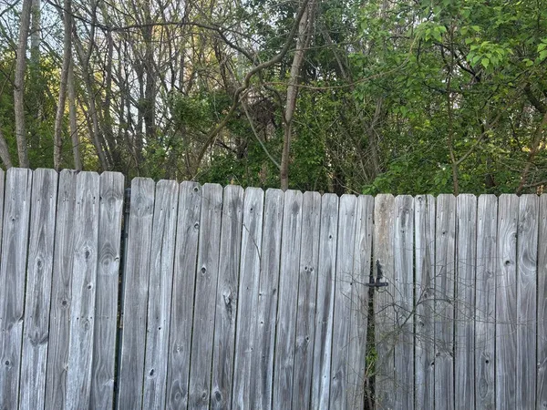 a view of a wooden fence