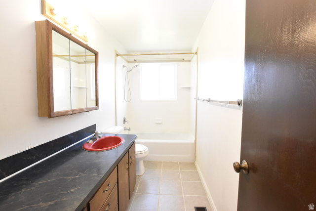 290 West 600 North Logan, UT 84321 - Photo 35 of 45 Bathroom featuring a lengthy vanity with a dark countertop and red basin sink