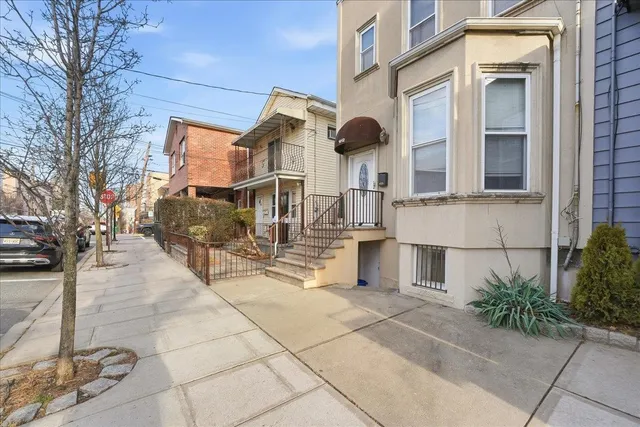 a living room with furniture and a gym