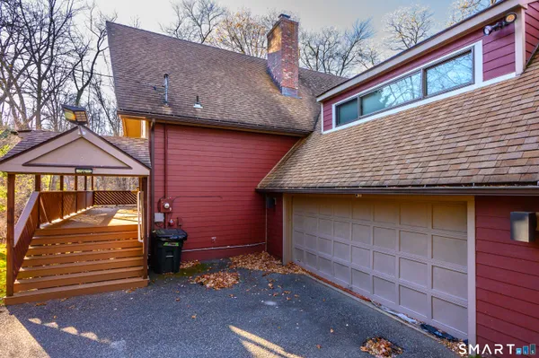 a view of brick house with large windows