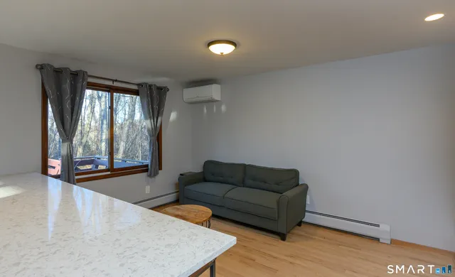 a living room with furniture and a window