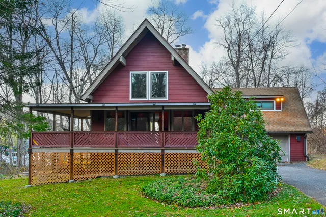 a view of a yard with large trees