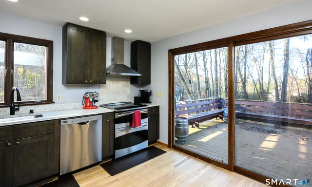 a kitchen that has a sink and a stove