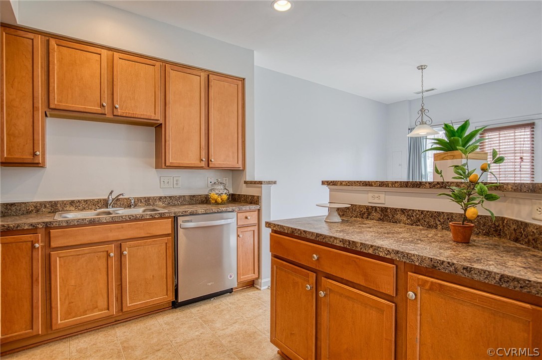 7292 Hardtack Road Mechanicsville, VA 23116 - Photo 12 of 34 a kitchen with stainless steel appliances granite countertop wooden cabinets and a granite counter tops