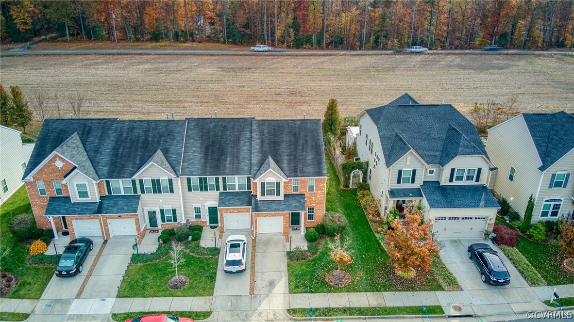 7292 Hardtack Road Mechanicsville, VA 23116 - Photo 31 of 34 an aerial view of residential houses with outdoor space and lake view