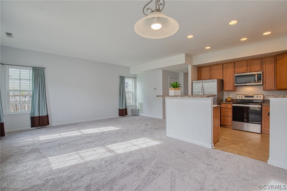 7292 Hardtack Road Mechanicsville, VA 23116 - Photo 6 of 34 a view of a kitchen with a sink and dishwasher a refrigerator with wooden floor