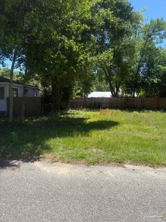 a view of a patio with a yard
