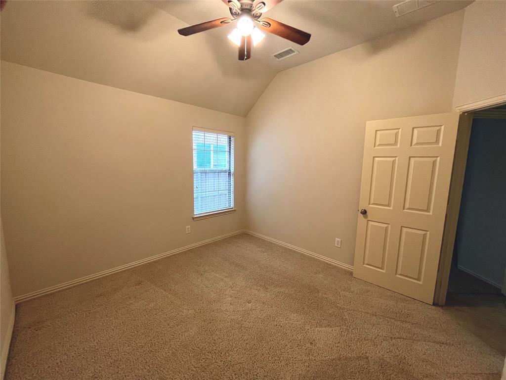 4101 White Porch Road Plano, TX 75024 - Photo 14 of 18 Secondary bedroom with a ceiling fan.