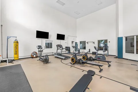 a living room with furniture and next to a window