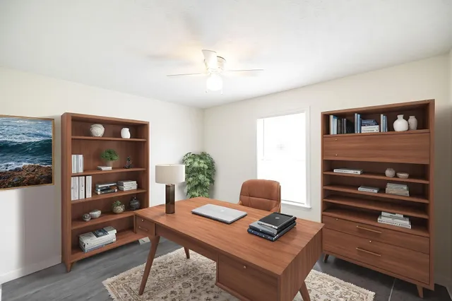 a workspace with furniture and window