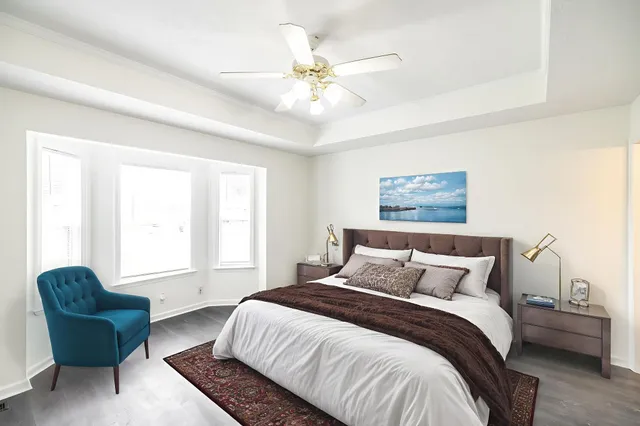 a bedroom with a bed and a couch