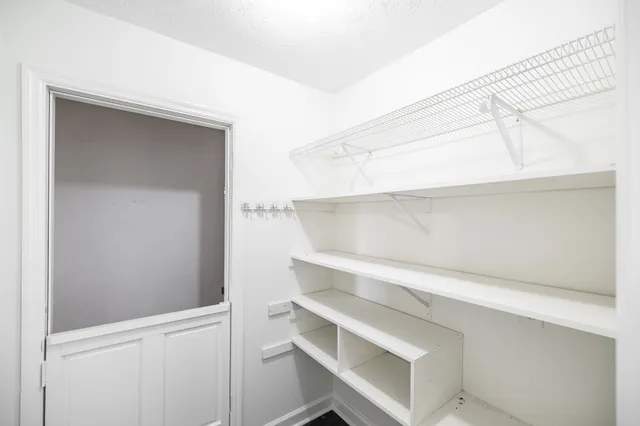 a view of an empty walk in closet